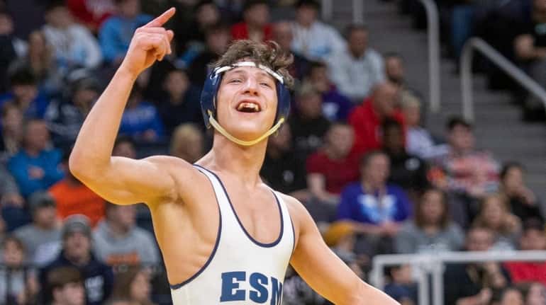 Zach Redding of Eastport-South Manor celebrates the win after wrestling...