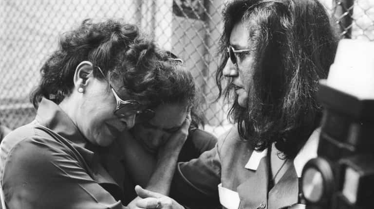 Marie Alonso, left, mother of Joel Rifkin victim Anna Lopez, shares...