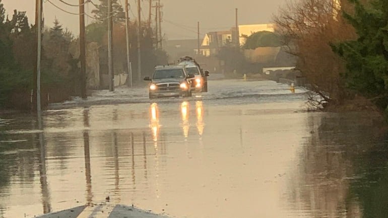 Flooding on Dune Road in Quogue, a village in the...