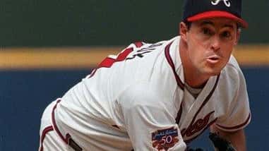 Atlanta Braves pitcher Greg Maddux throws to the plate during...