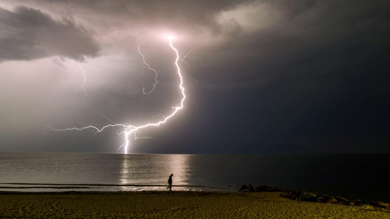 A bolt of lightning over the Long Island Sound was...