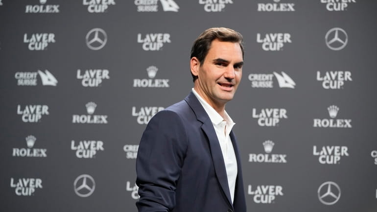 Switzerland's Roger Federer arrives for a media conference ahead of...