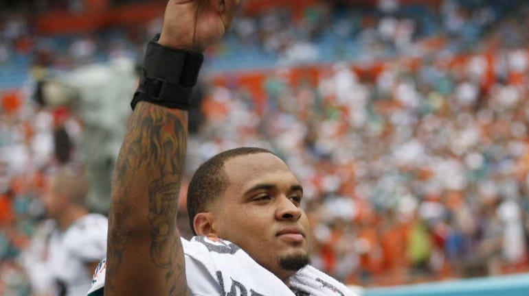 Miami Dolphins center Mike Pouncey celebrates during the second half...