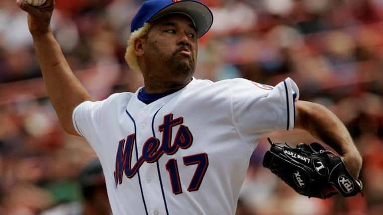 Mets' Jose Lima pitches against the Braves in the 2nd...