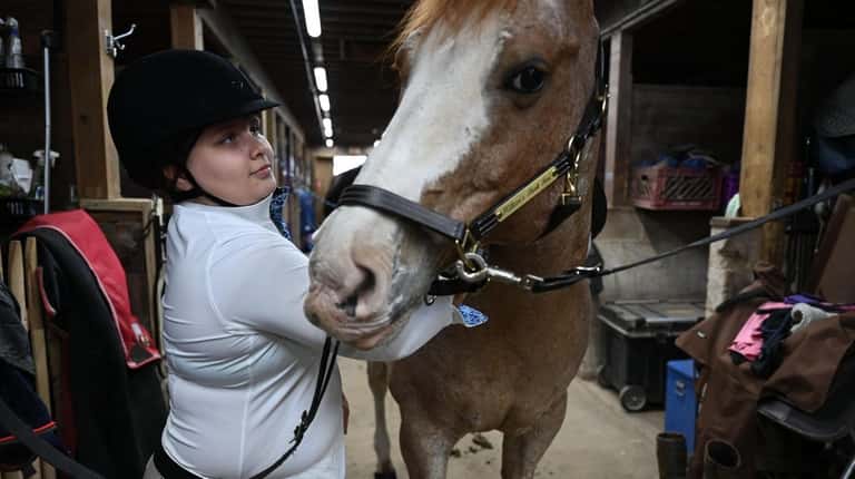 Ella Angelico, 11, of Bellmore, who has been riding for...
