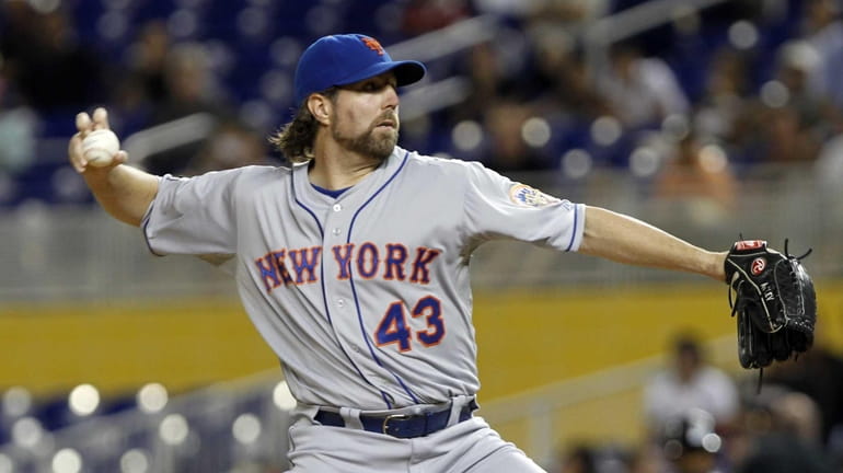 R.A. Dickey pitches to the Miami Marlins during the first...