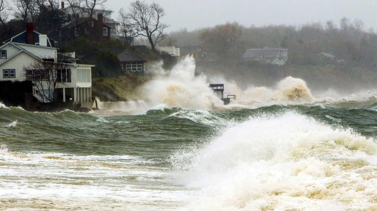 The Long Island Sound pounds homes in Southold on Oct....
