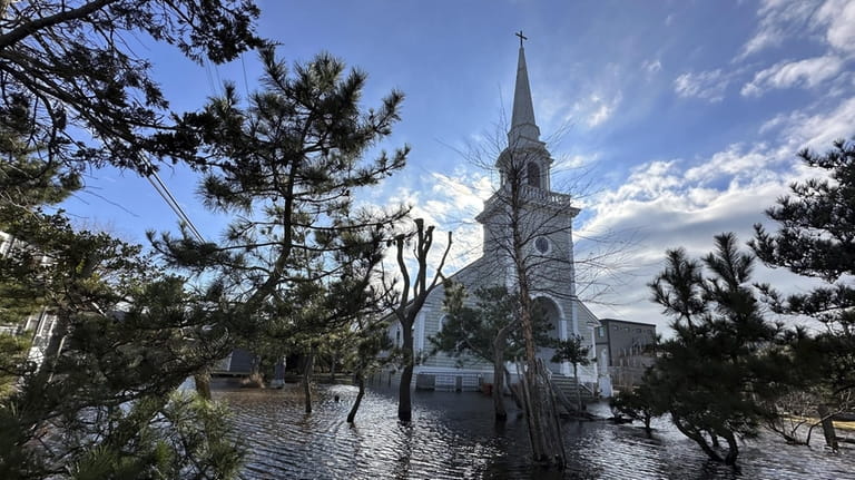 Flooding outside Ocean Beach's Our Lady of the Magnificat Catholic...