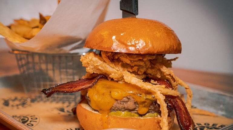 A burger with Bacon, Cheddar and fried onions at Burgerology.