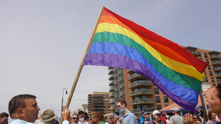 LGBT Network President David Kilmnick, left, carries the Pride flag



	 