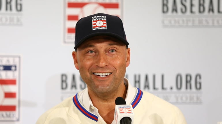 Derek Jeter speaks to the media after being elected into...