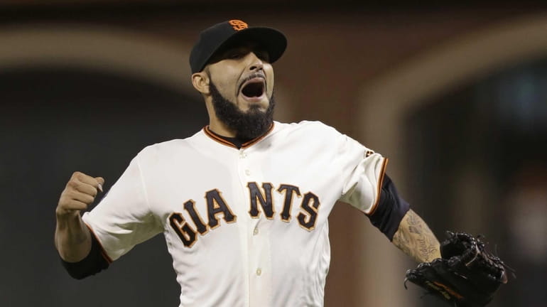 San Francisco Giants closer Sergio Romo reacts after the Giants...
