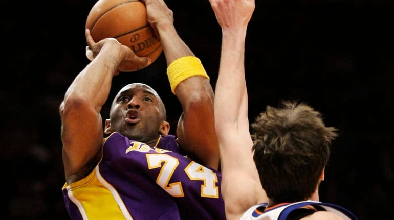 Lakers guard Kobe Bryant shoots over Knicks forward Danilo Gallinari...