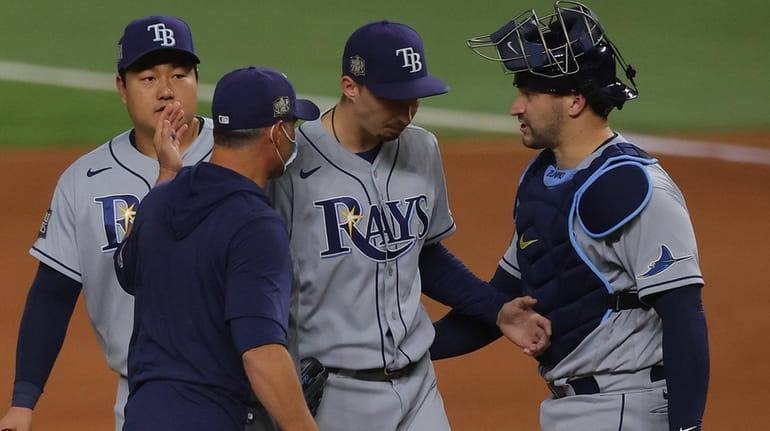 Blake Snell of the Tampa Bay Rays is taken out of...