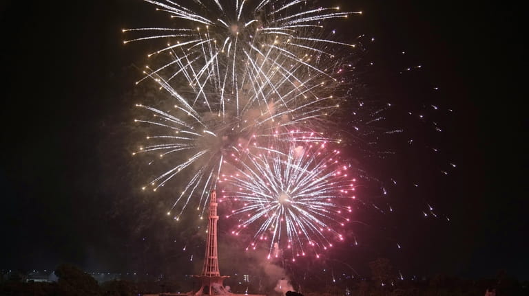 Fireworks light the sky close to the Minar-e-Pakistan or Pakistan...