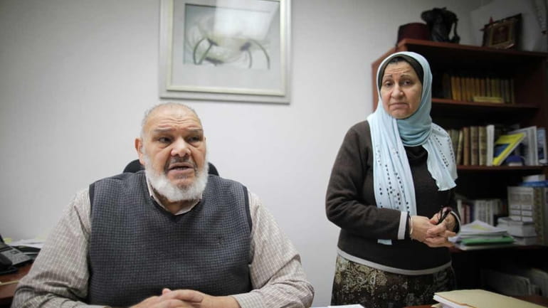 Mohammed and Nagiba el-Sioufi are seen in their office as...