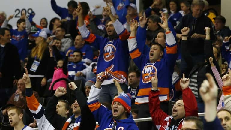 Fans cheer after a New York Islanders' third-period goal against...