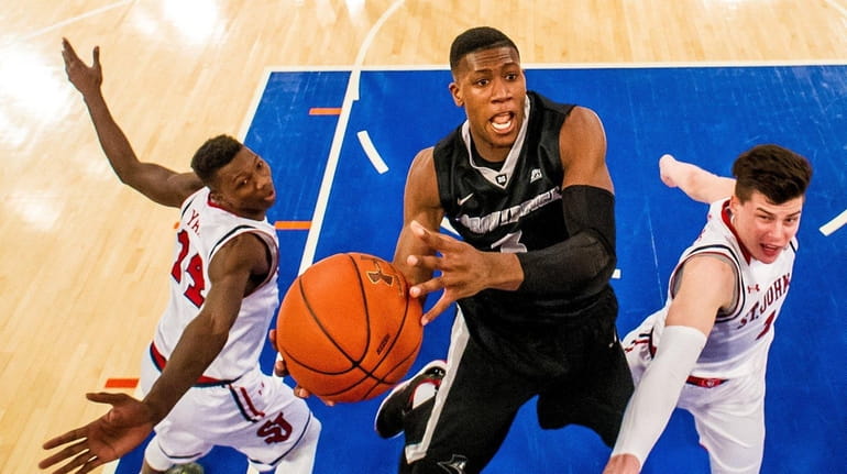 Providence guard Kris Dunn (3) attempts a lay up against...