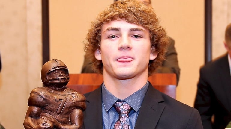 Westhampton's Liam McIntyre poses with the Hansen Award on Dec....