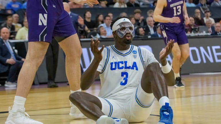 UCLA forward Adem Bona (3) reacts after being called for...