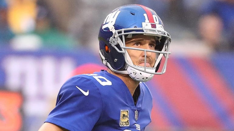 Giants quarterback Eli Manning looks on against the Rams during...