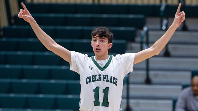 Chris Zannino of Carle Place celebrates after hitting a 3-pointer...