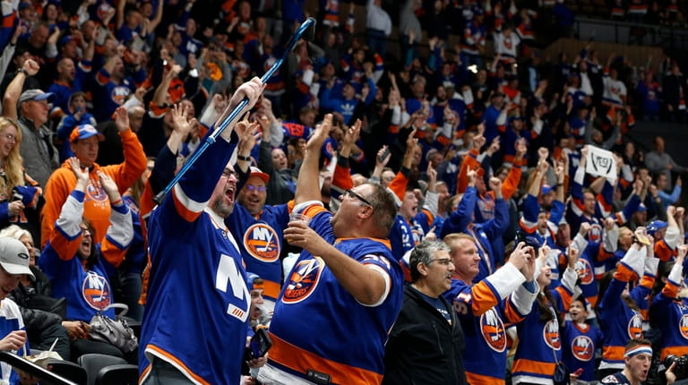 Islanders fans celebrates a goal in the third period against...