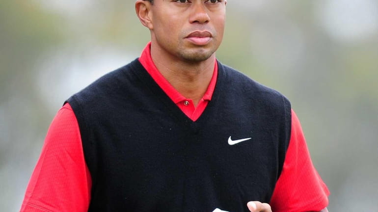 Tiger Woods of the US heads for the green at...