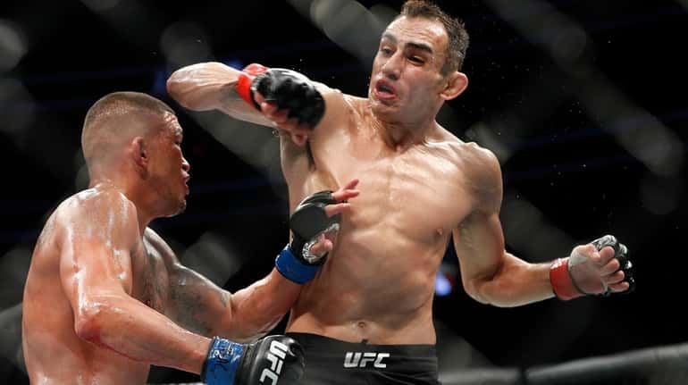 Tony Ferguson, right, fights Anthony Pettis during a lightweight mixed...