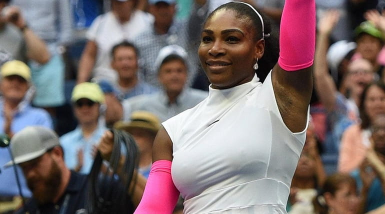 Serena Williams reacts after she wins her match against Yaroslava...