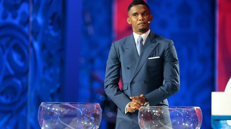 FILE - Cameroon's striker Samuel Eto'o stands behind the lots...
