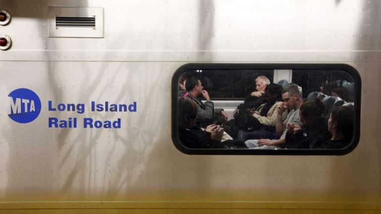 RIders on a LIRR train at Penn Station (Feb 27,...