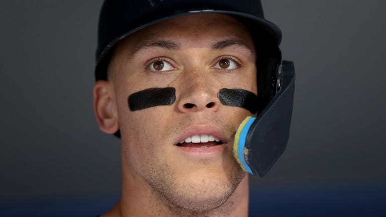 Aaron Judge #99 of the Yankees looks on during the first...