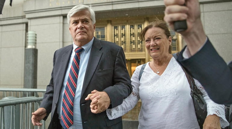 Dean Skelos, left, and his wife Gail leave federal court...