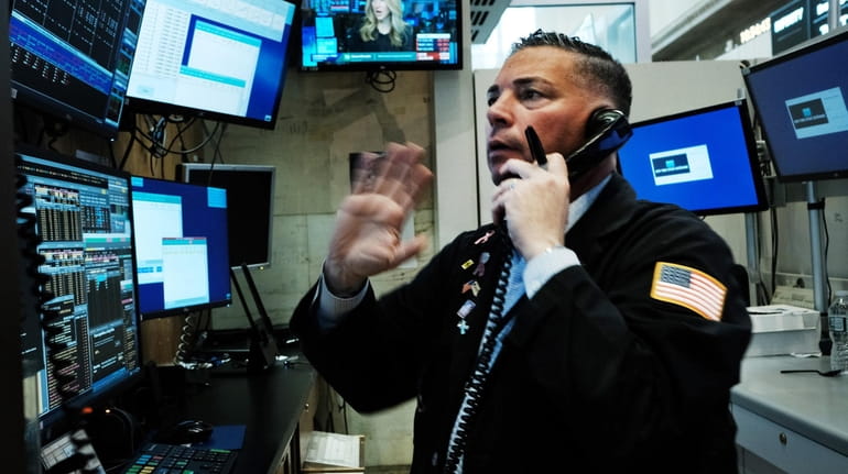 Traders at the New York Stock Exchange on Monday saw...
