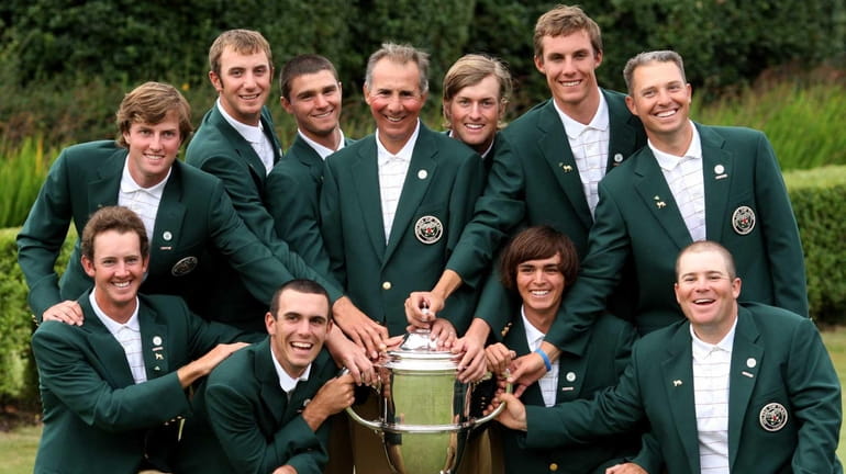 U.S. Walker Cup players pose with the trophy after winning...