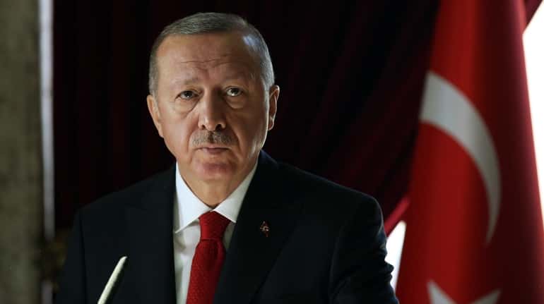 Turkish President Recep Tayyip Erdogan speaks during a visit to...