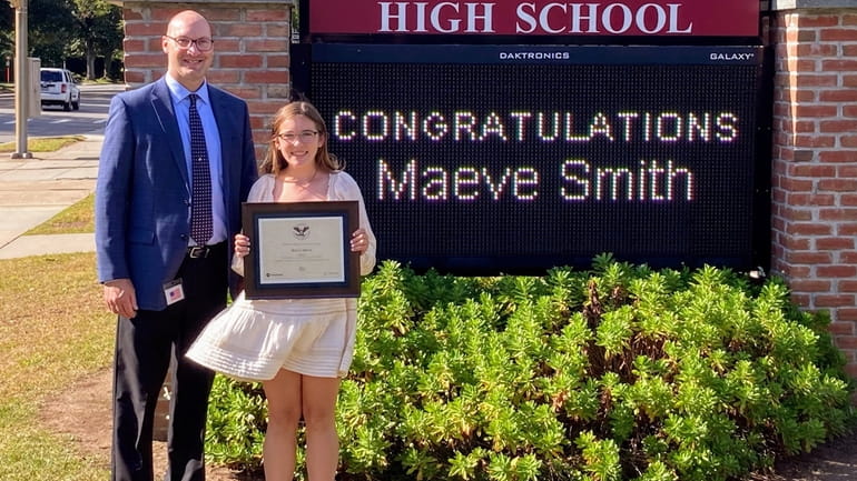 Maeve Smith, pictured with Garden City High School Principal Kevin...