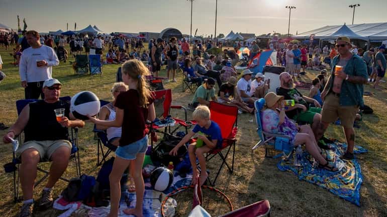 Concertgoers seen on the main lawn at the Great South...