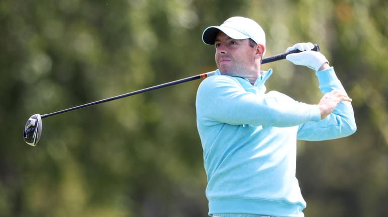 Rory McIlroy of Northern Ireland plays his shot from the...