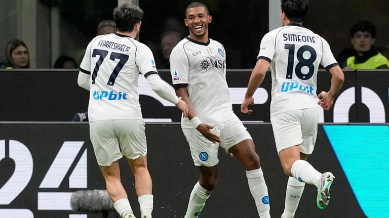 Napoli's Juan Jesus, center, celebrates after scoring his side's first...