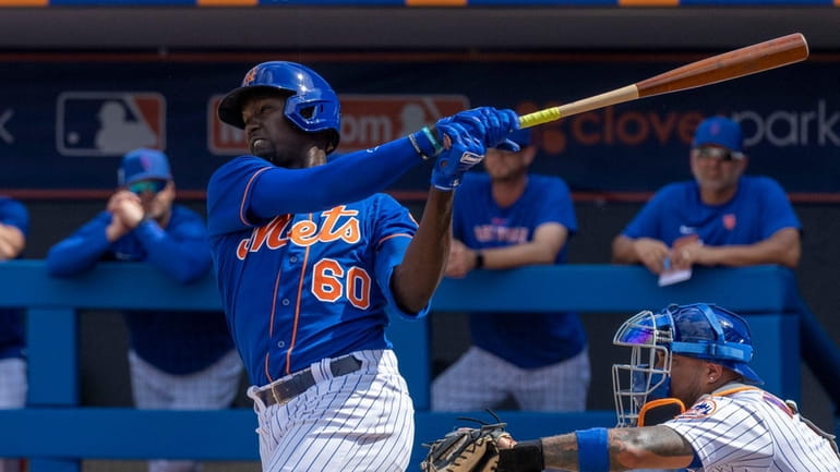 Mets infielder Ronny Mauricio bats during a spring training intrasquad...