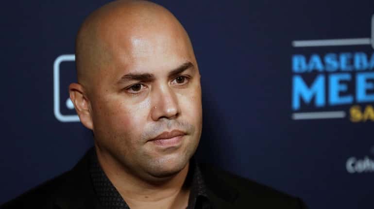 Mets manager Carlos Beltran listens to a question during the...