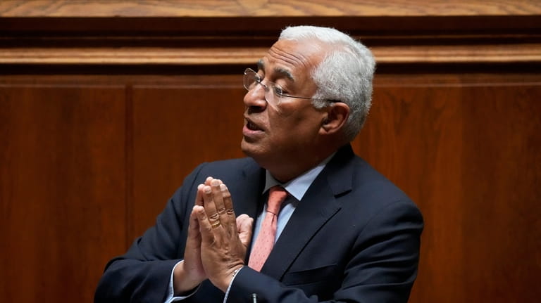 Portuguese Prime Minister Antonio Costa gestures while answering questions during...