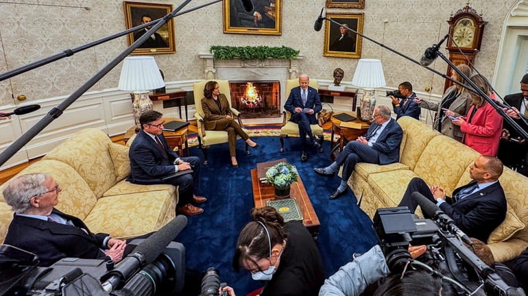 President Joe Biden meets with Senate Minority Leader Mitch McConnell...