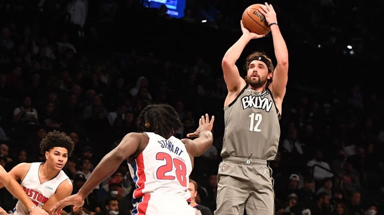 Brooklyn Nets forward Joe Harris shoots a three-point basket against...