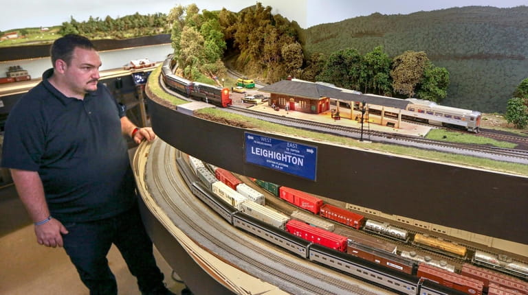 A member of the West Island Model Railroad Club watches as...