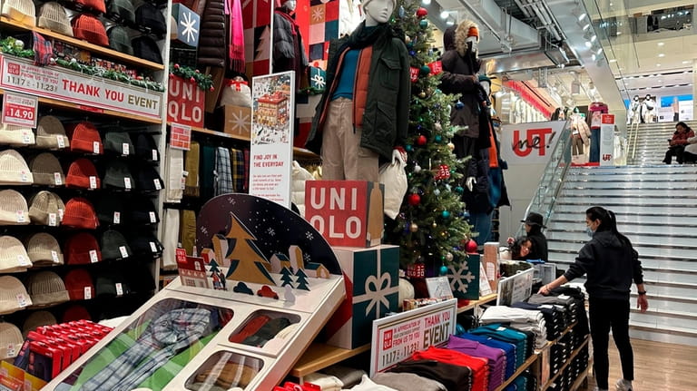 Shoppers looks at items displayed at the Uniqlo stores in...