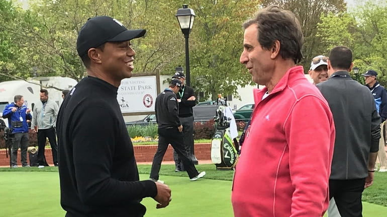 Tiger Woods, left, and SiriusXM host Chris "Mad Dog" Russo...