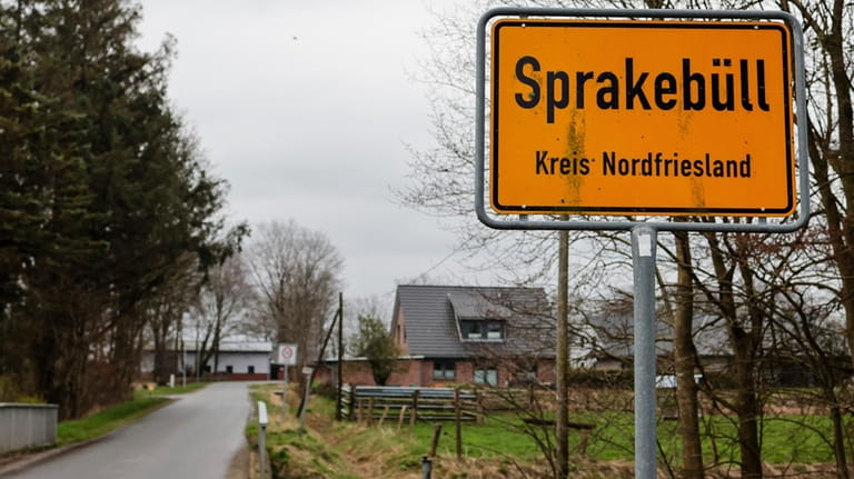 The town sign for Sprakebüll is at the side of...